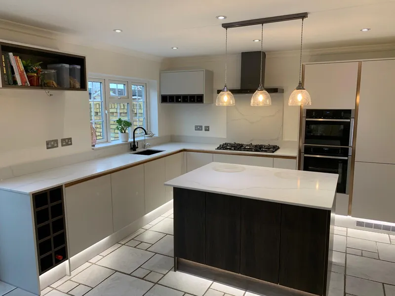 Open-plan kitchen with island and marble-effect quartz worktops.